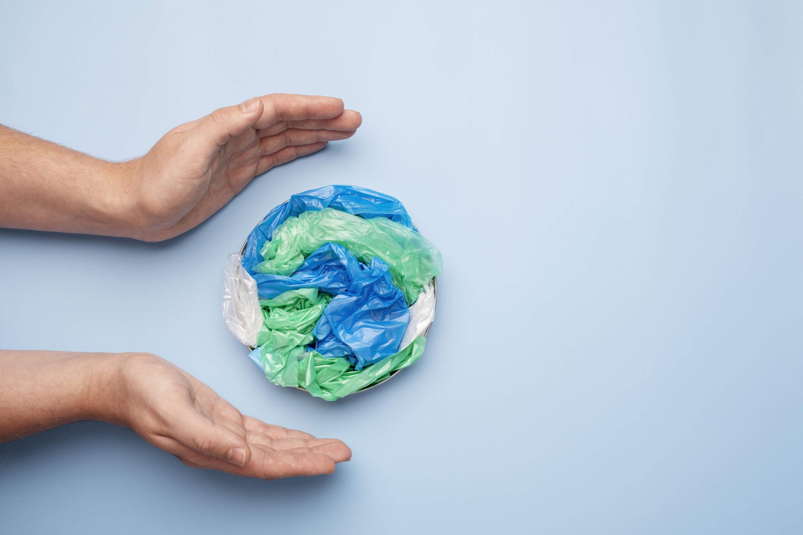 close-up-on-hand-with-plastic-earth